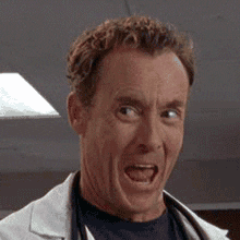 TV gif. John C. McGinley as Dr. Cox on Scrubs laughs in wide-mouthed glee and shakes his head in jubilation.